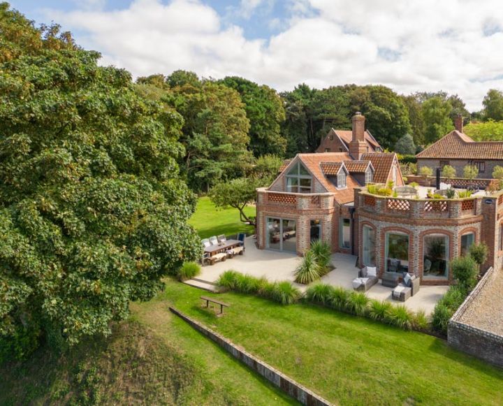 Aerial view of a large country house and its gardens